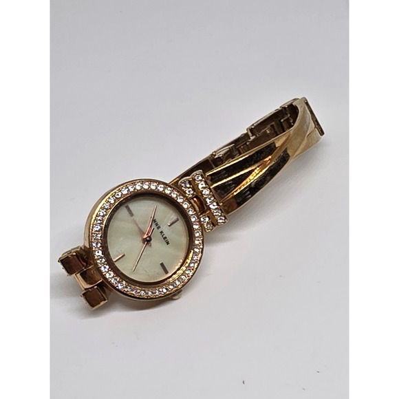 Anne Klein Gold Tone Rhinestone Bezel Mother of Pearl Dial Bracelet Watch - Picture 1 of 3